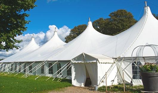 a group of luxury portable restrooms with individual stalls and running water in River Oaks